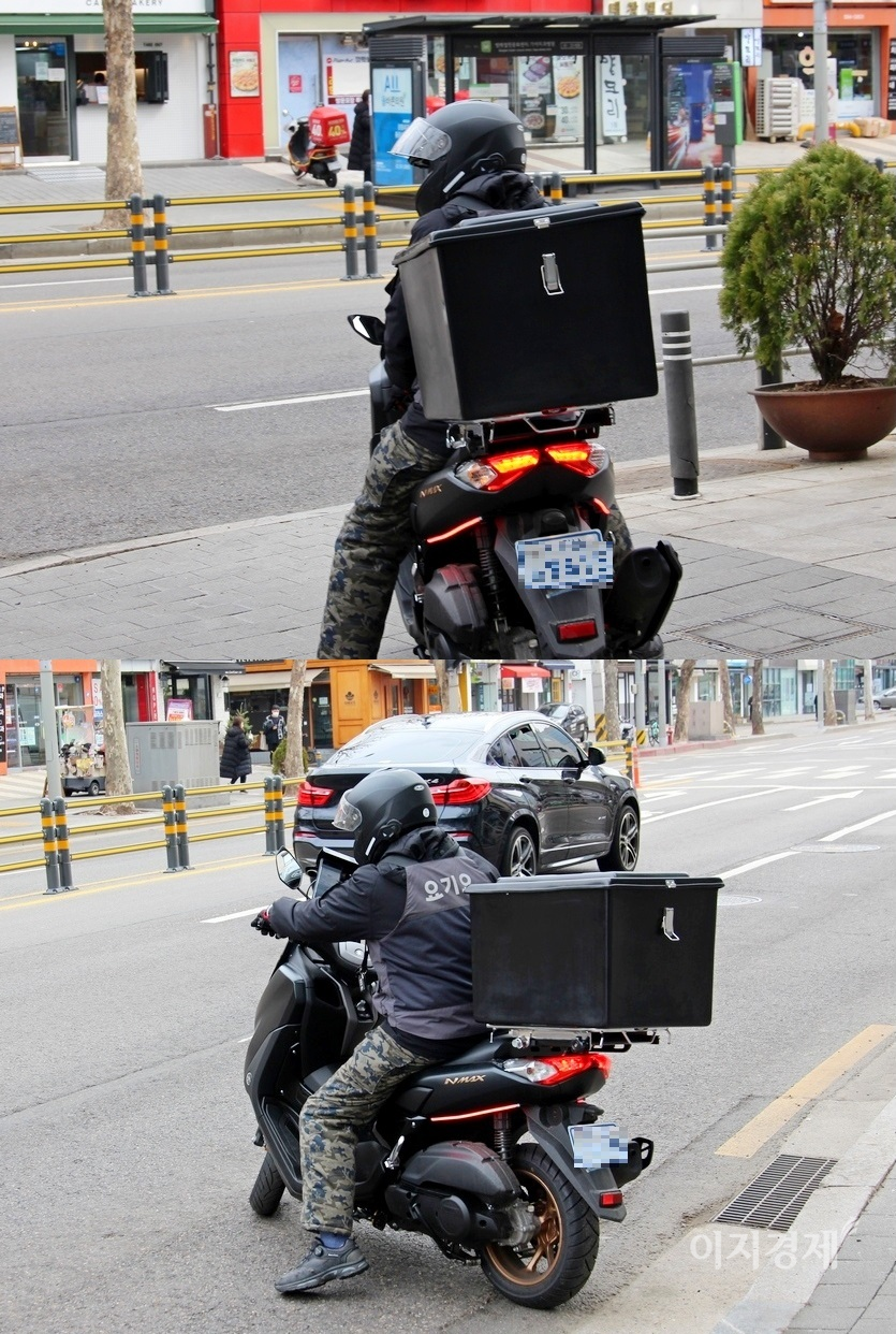 인도에서 차도로 나간 배달원도 요기요가 새겨진 옷을 입고 있다. 사진=김보람 기자