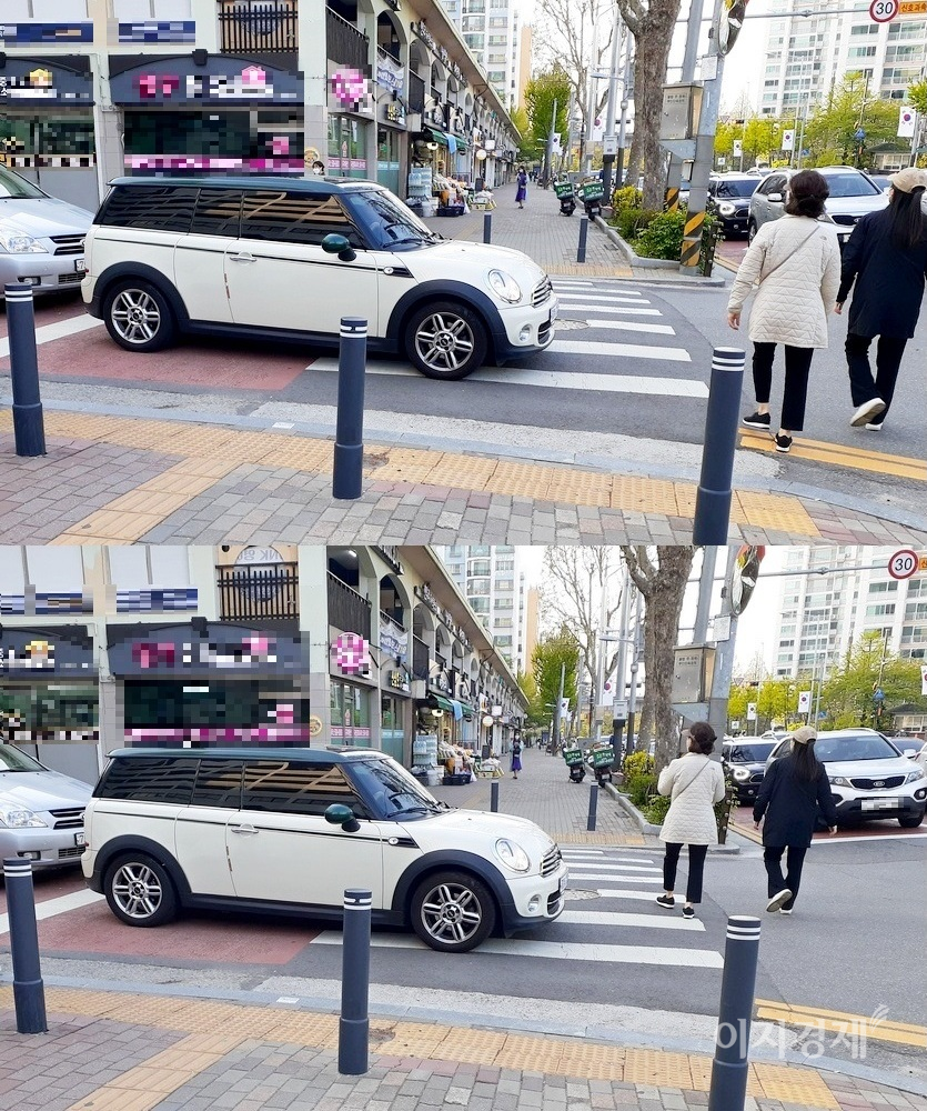 BMW의 소형차 브랜드 미니 쿠퍼가 주택가 골목에서 주도로인 방배로로 합류하기 위해 정지선을 넘어 대기하고 있다. 정지선 앞에 멈춰도 방배로의 차량 흐름을 볼 수 있다. 미니 쿠퍼 때문에 행인들이 횡단보도를 벗어나 길을 건너고 있다. 사진=정수남 기자