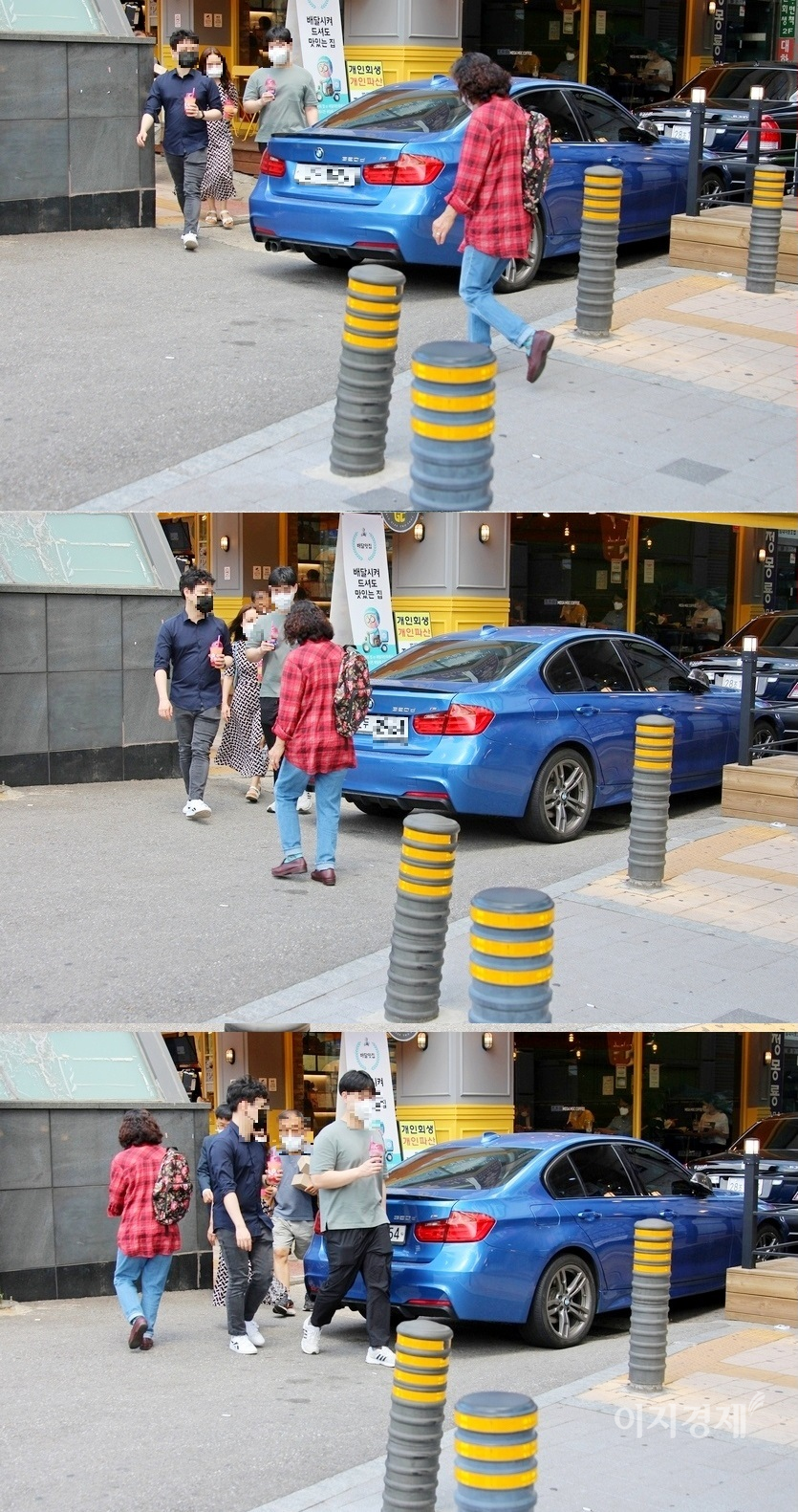 폭 7∼8미터의 인도와 주택가로 들어가는 골목이 만나는 지점에 320d의 M 버전이 자리했다. 사진 왼쪽 검은색 구조물이 지하철 출입구 벽이다. 이로 인해 7∼8미터의 인도가 폭 3미터도 정도로 좁아진다. 320d의 M 버전의 불법 주정차로 교행이 어렵다.  320d의 M 버전이 인도 복판에 있는 셈이다. 사진=정수남 기자